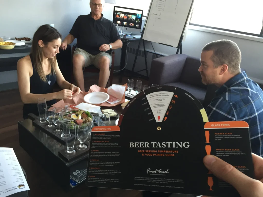 Team members enjoying a beer tasing social event