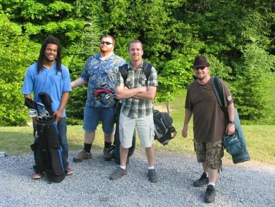 team members posing during a golf event