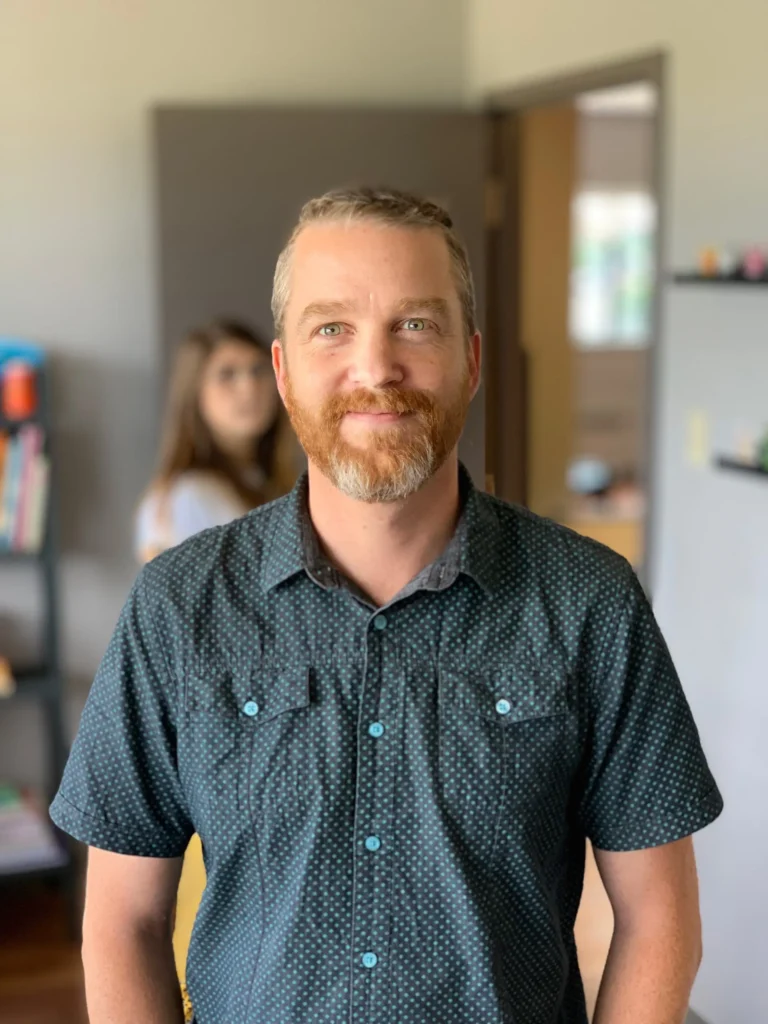 Seb posing for the camera with Fran in the background photo bombing