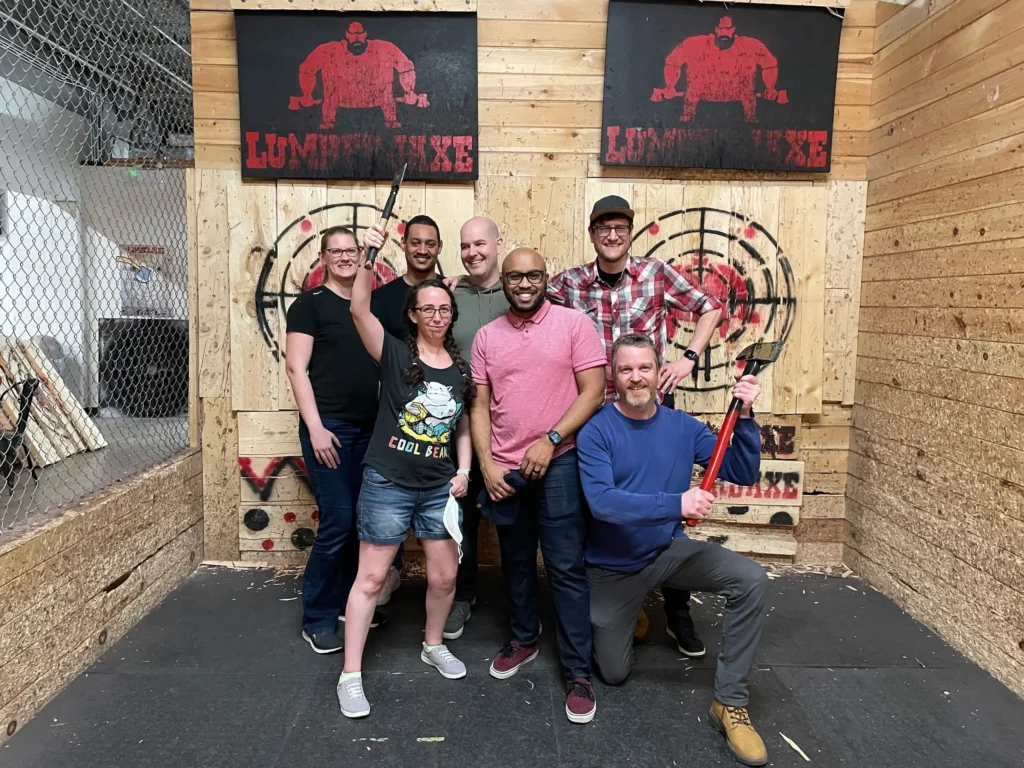 team celebrating an axe throwing social event at Lumberjaxe