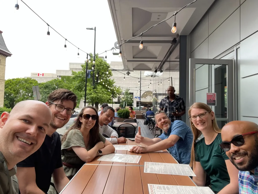 Team members unwinding after work on Brown's Social House patio