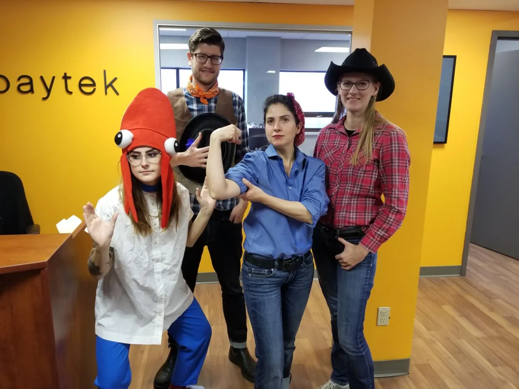 team posing with their halloween costumes