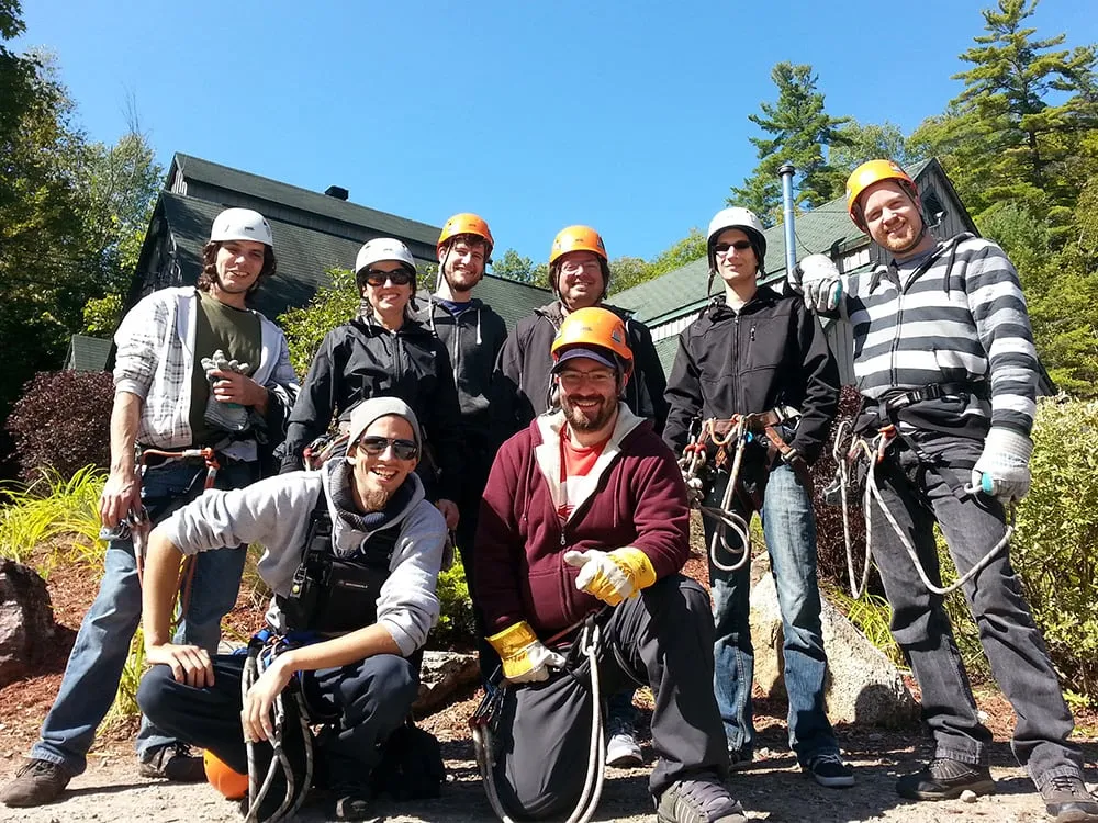 team posing for a group shot at zipling social event