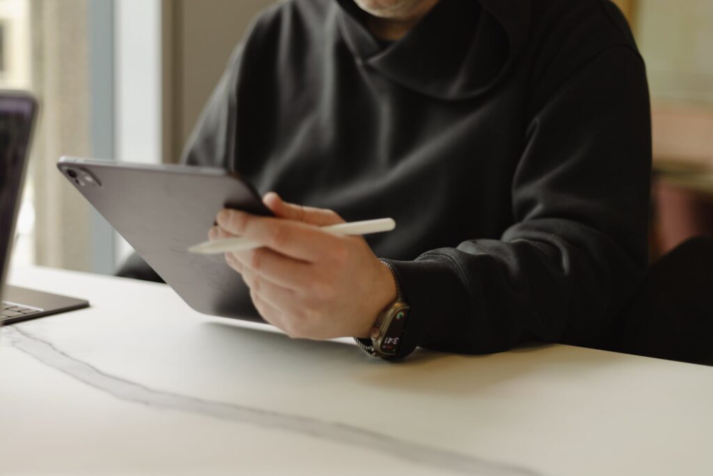 Chad holding a tablet