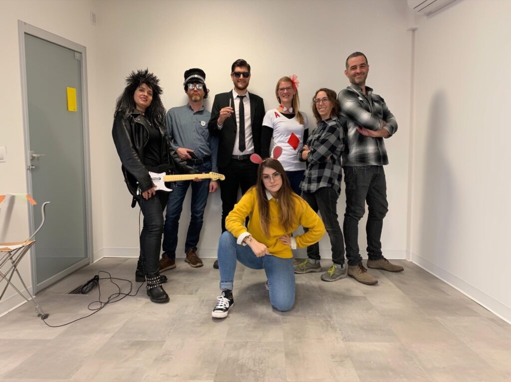 Our team posing in Halloween costumes