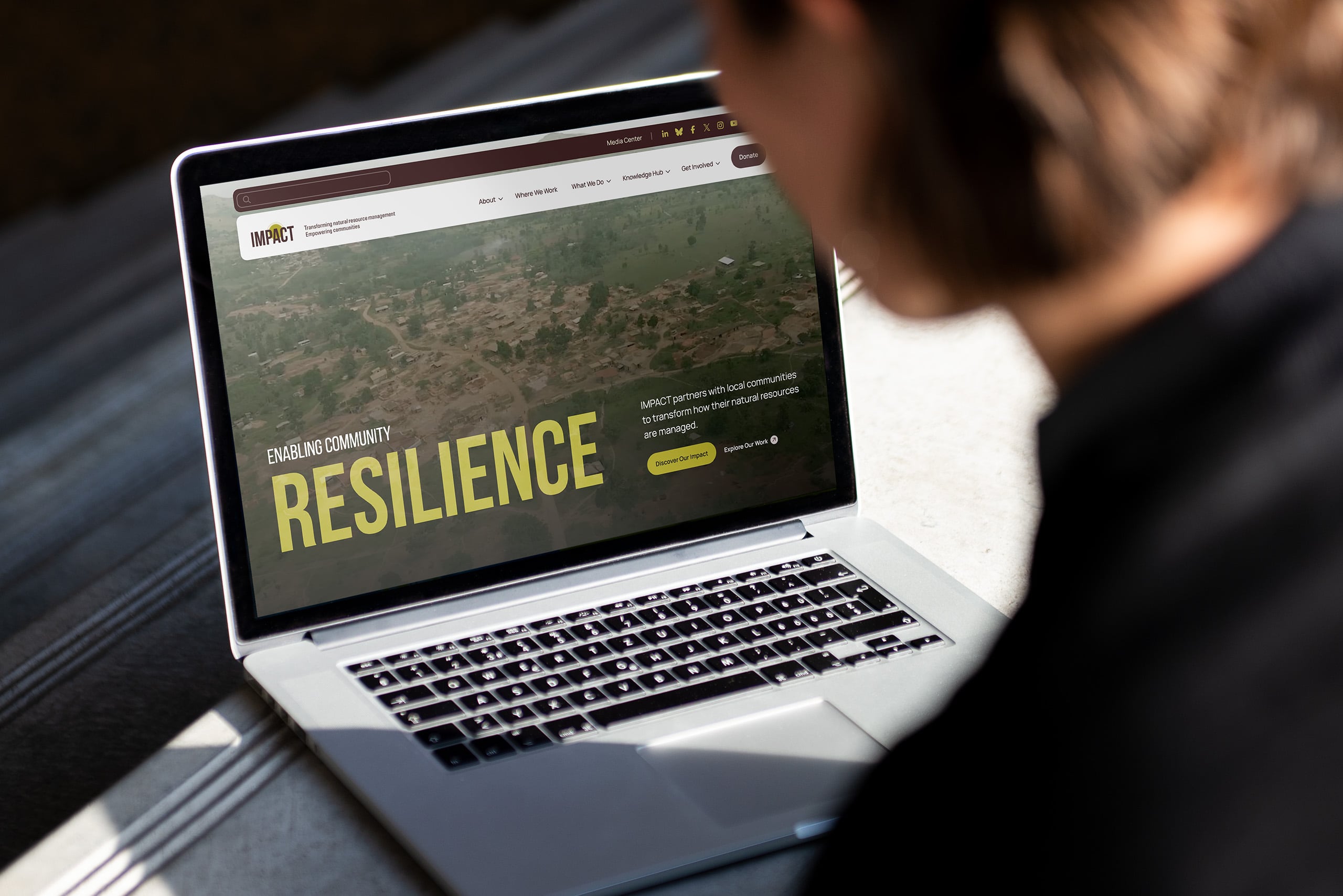 The new IMPACT website shown on a laptop screen